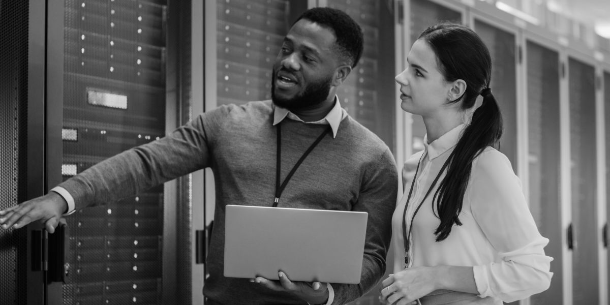 two engineers in a server room